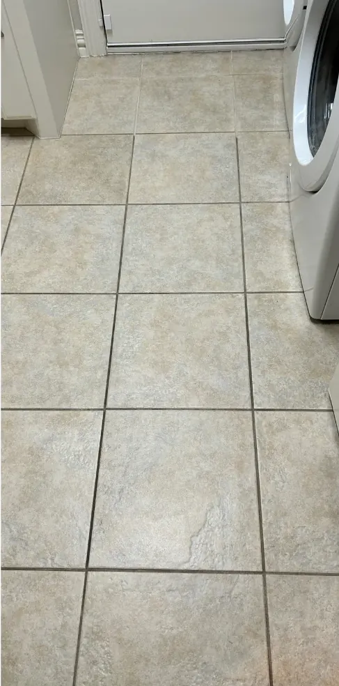 Laundry room grout color sealing — before cleaning